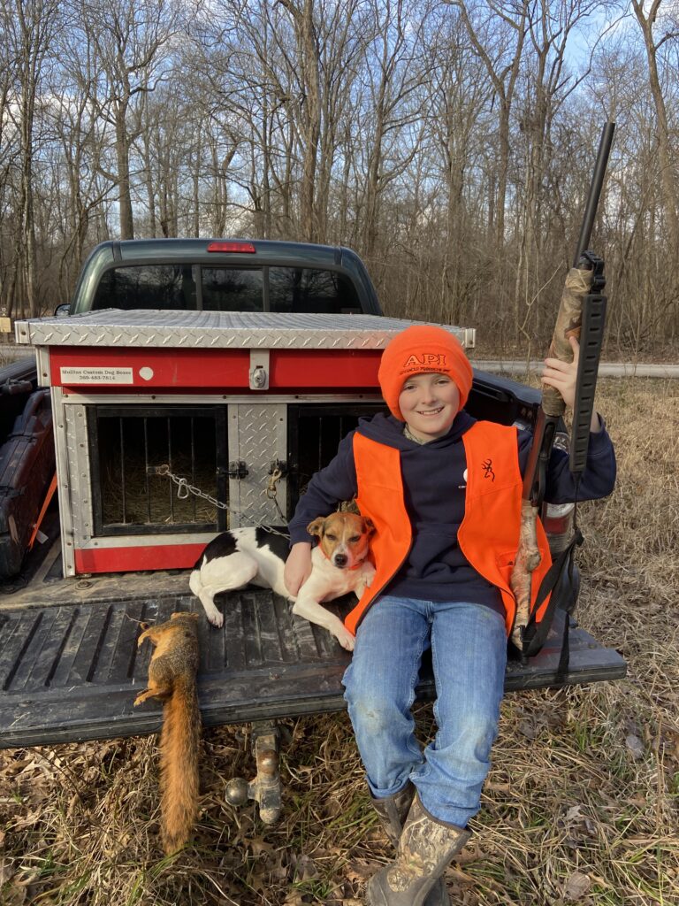 A boy with his squirrel dog