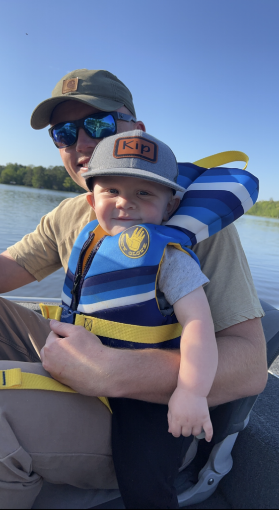 Kip and Dada driving the boat