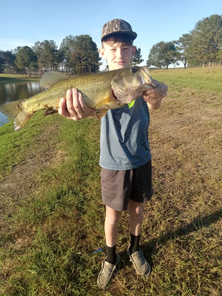 Ethan Holifield catches 6lb bass out of the family pond!!